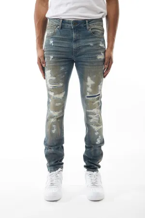 Ripped and Repaired Denim Jeans in Cobalt