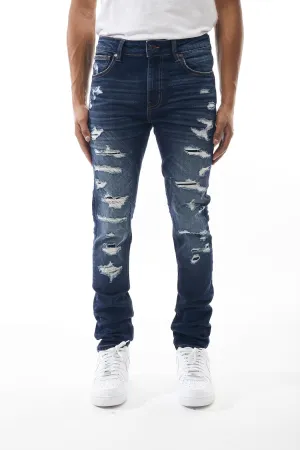 Ripped and Repaired Denim Jeans in Dusty